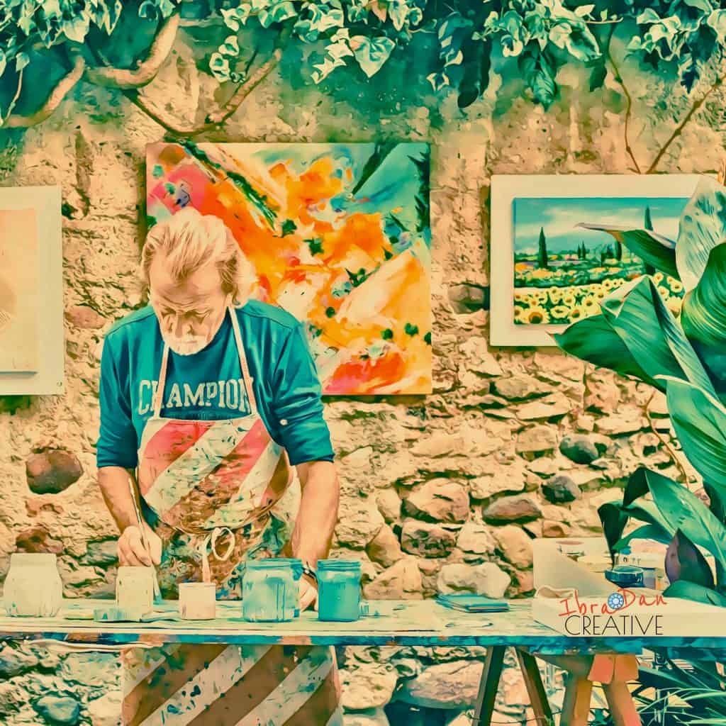 Artist against brick wall - creative career change and reinvention after traditional job loss