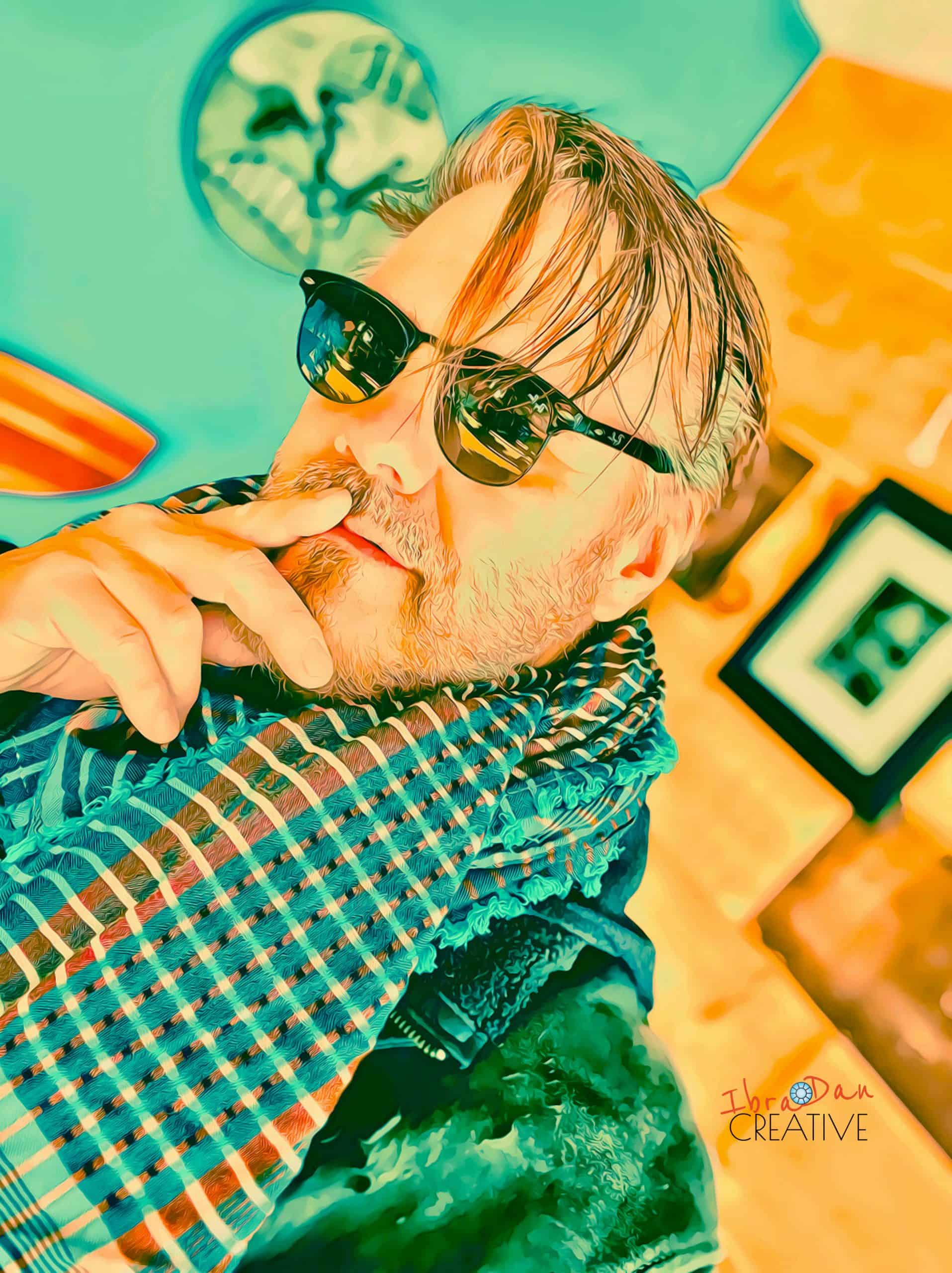 DanTorHandFace.1436x1920 Daniel-Ibrahim. -Creative professional working on artistic content with vibrant colors and imaginative designs representing the essence of creativity
